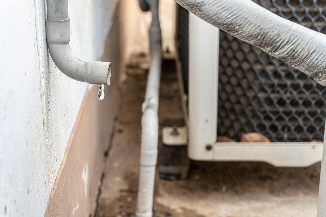 water dripping from an outdoor ac unit